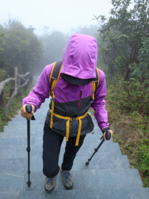 Hiker climbing to mountain top