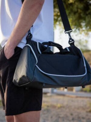 Close up of a sportsman's training bag in an outdoor gym, photo with copy space